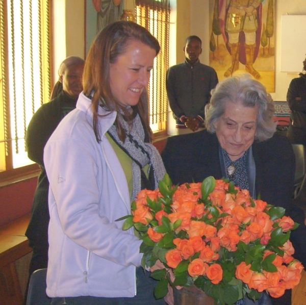 LynnKatsoules presented Elly Mullinos with 100 roses on behalf of the parish